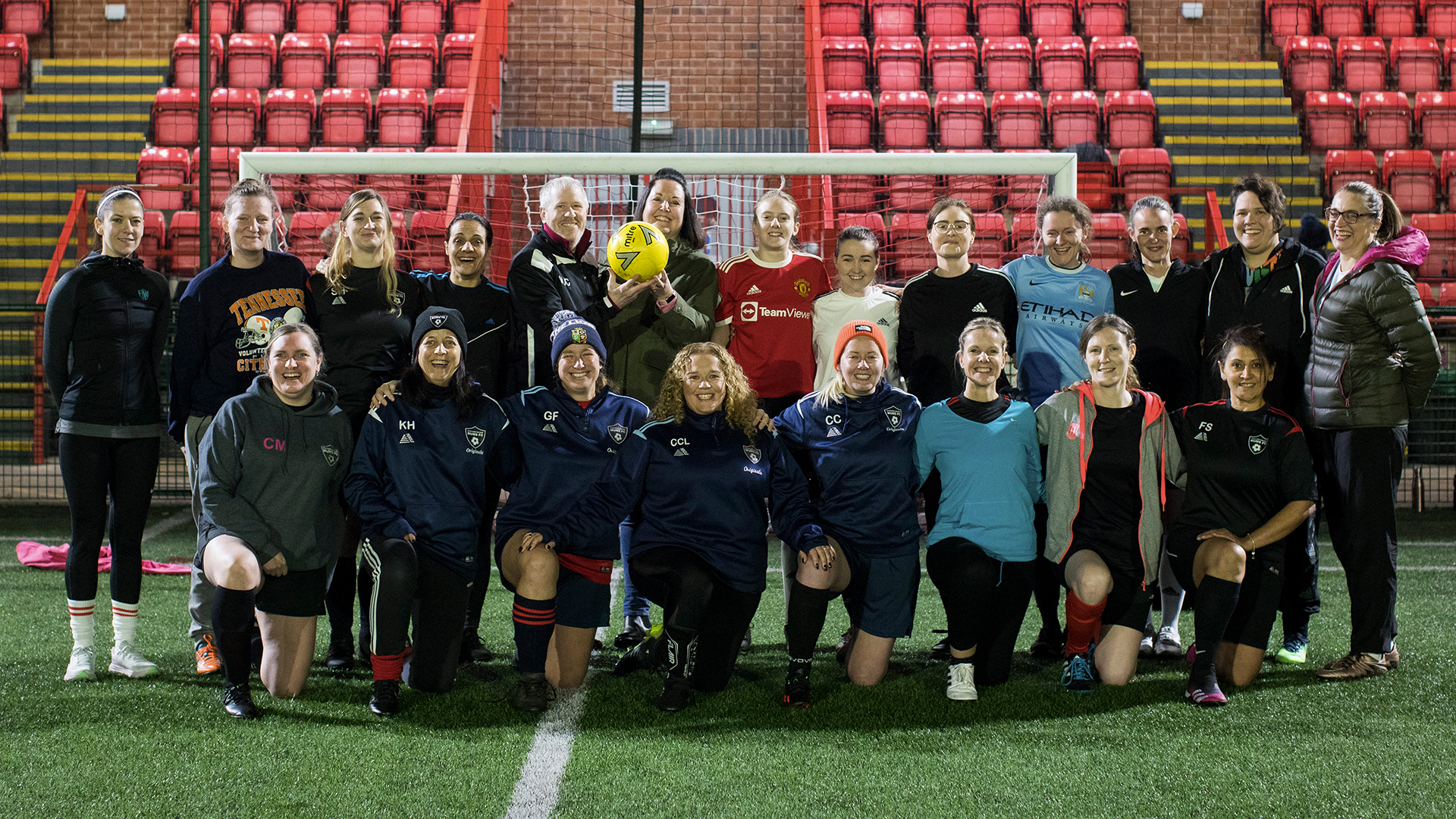 Stafford Soccer Mums FC members group shot with Samantha Allcott from Homes Plus